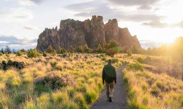 Man walking at sunset in Smith Rock State Park