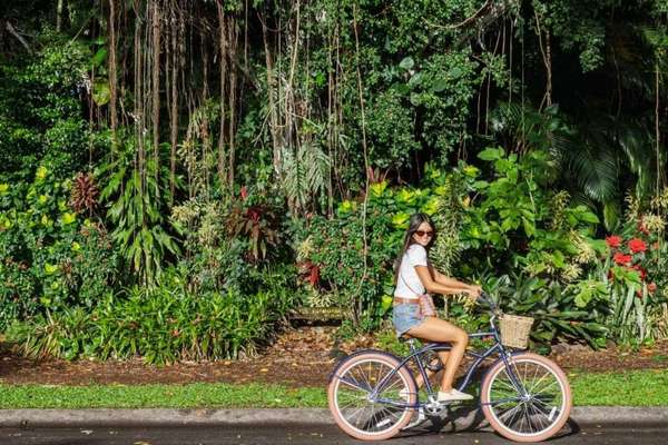 Woman riding a bike in Hilo, Hawaii